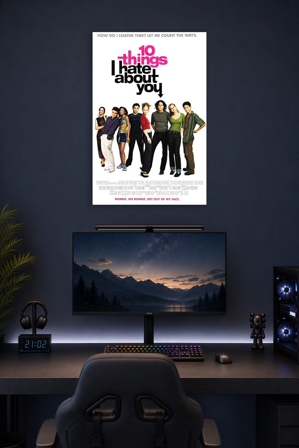 10 Things I Hate About You movie poster in a gaming desk setup above a monitor.