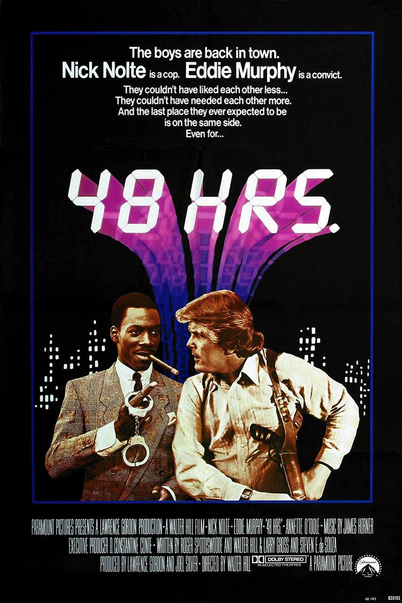48 Hrs. movie poster features Eddie Murphy holding handcuffs beside Nick Nolte with a holstered gun under a purple cityscape.