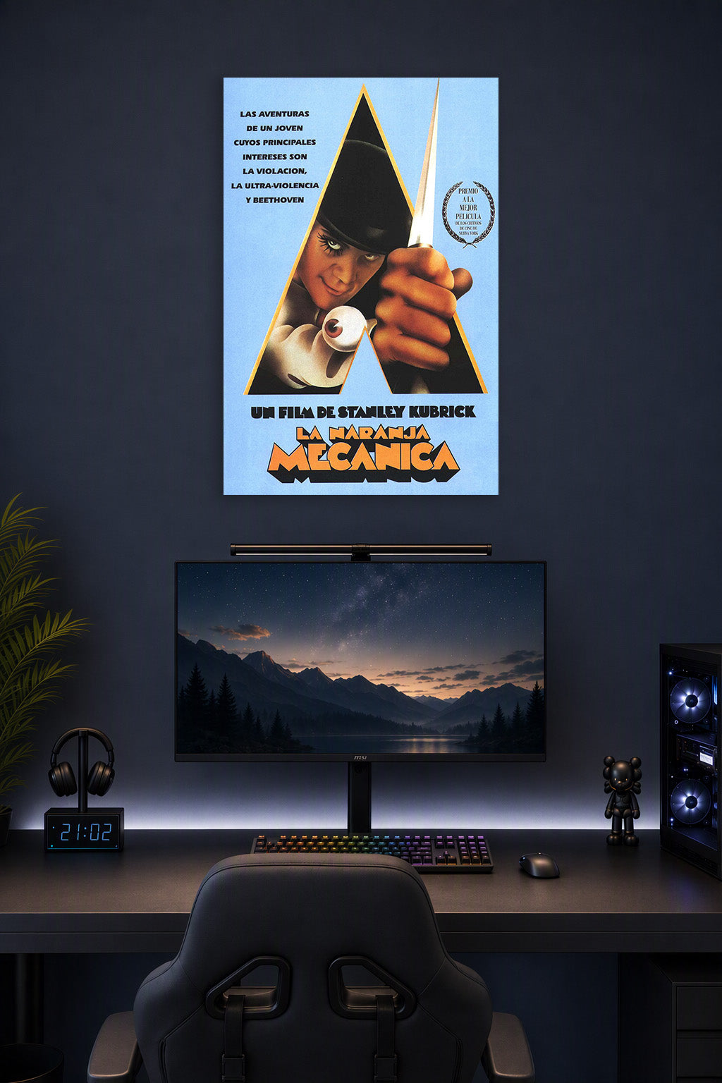 A Clockwork Orange Alex DeLarge in a gaming desk setup above a monitor.