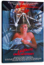 A Nightmare on Elm Street wall art print on stretched canvas depicts Nancy in bed beneath a clawed nightmare figure.