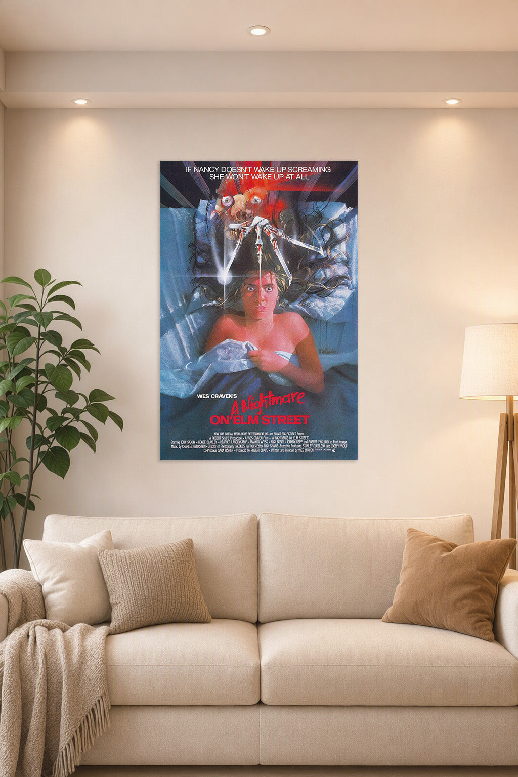 A Nightmare on Elm Street Freddy Krueger in a bright living room above a beige sofa.