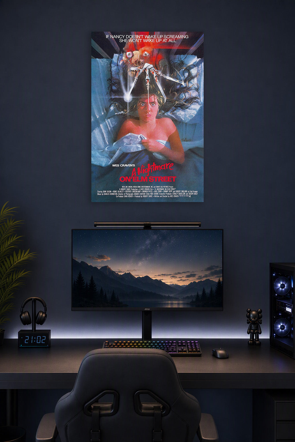 A Nightmare on Elm Street Freddy Krueger in a gaming desk setup above a monitor.