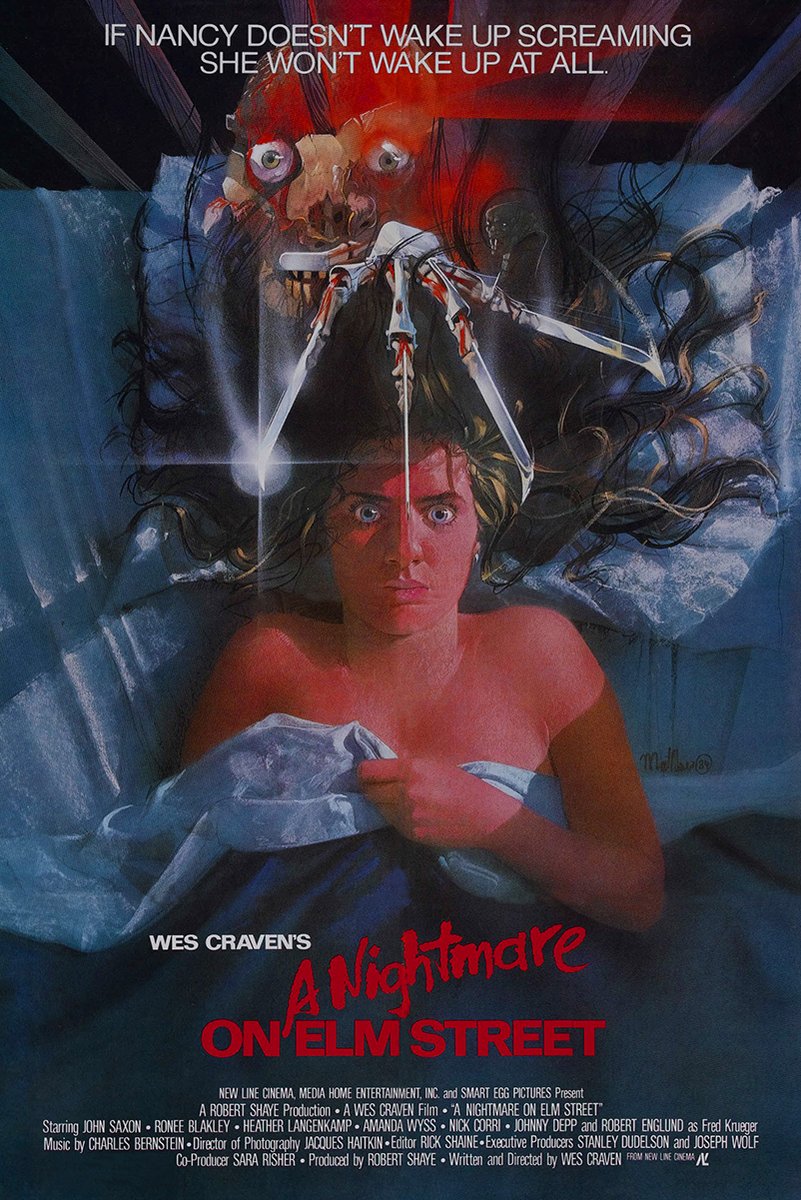 A Nightmare on Elm Street poster features Nancy awake in blue bedding beneath Freddy Krueger’s scarred face and bladed glove.