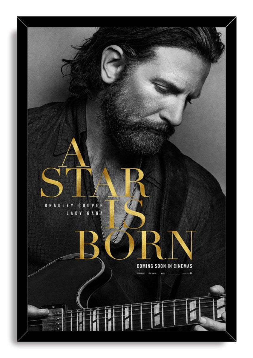 A Star Is Born framed wall art print of Bradley Cooper holding an electric guitar, with black-and-white portrait and gold lettering.