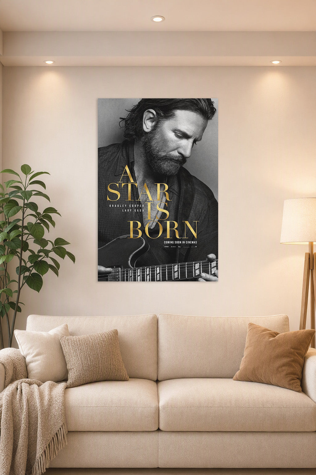 A Star Is Born Bradley Cooper in a bright living room above a beige sofa.
