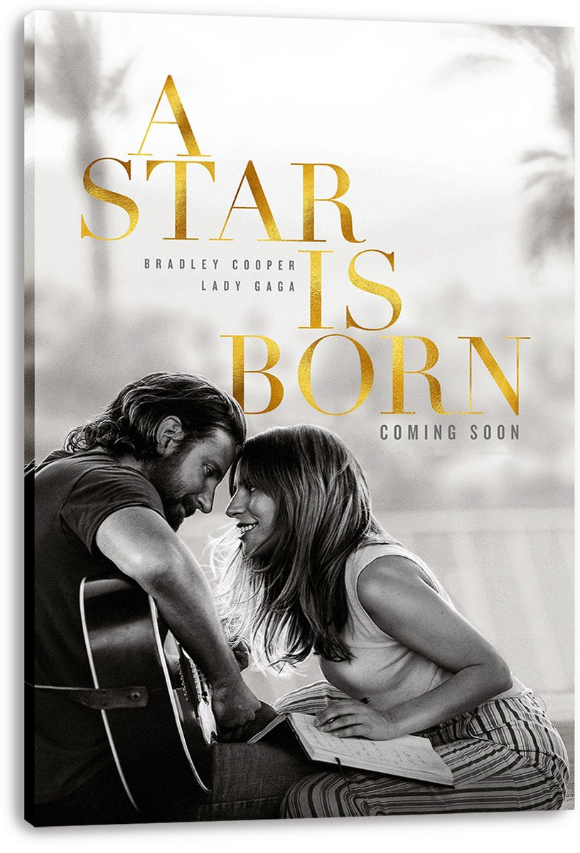 A Star Is Born canvas wall art print featuring Bradley Cooper with guitar and Lady Gaga seated with a notebook beneath gold lettering.