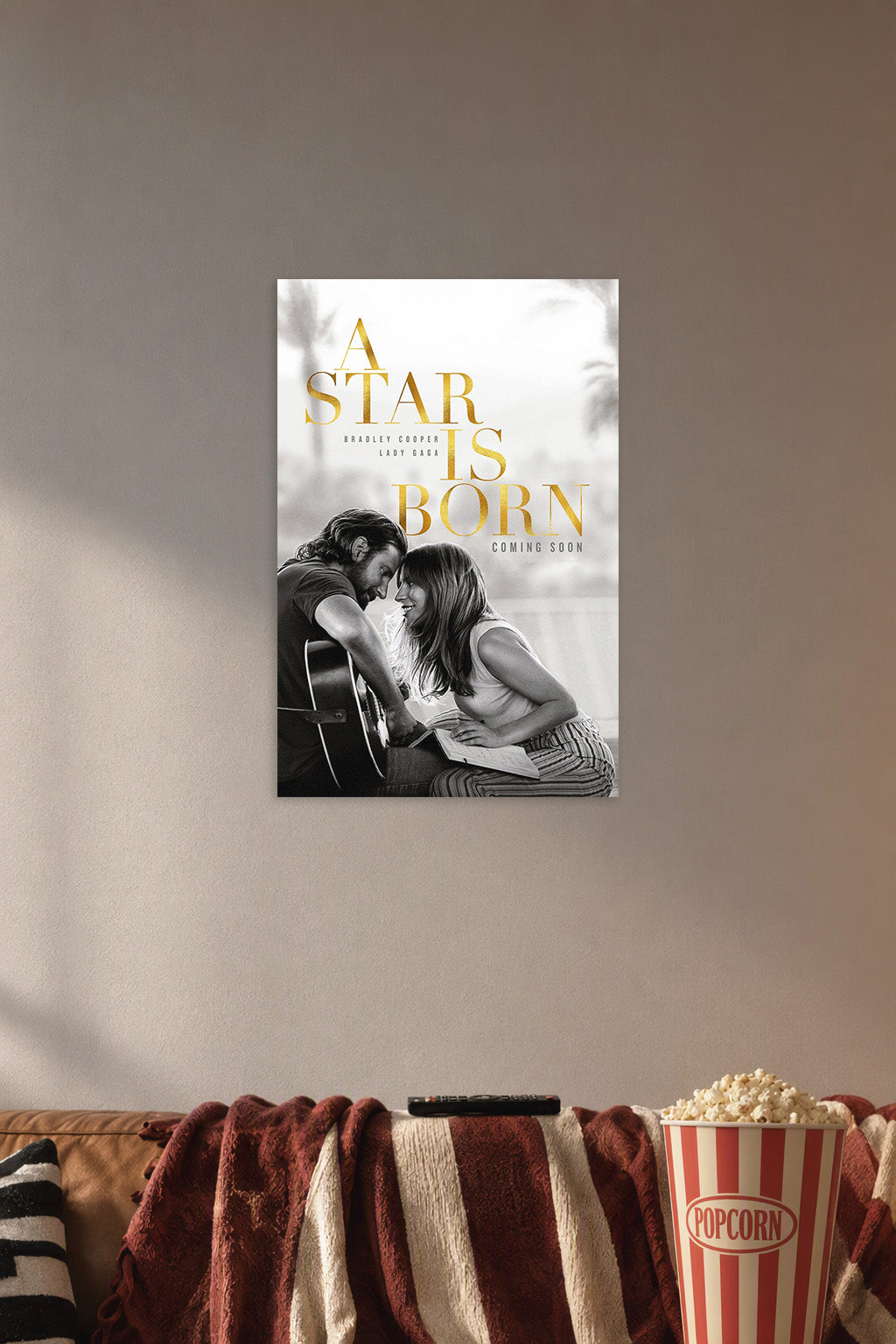 A Star Is Born Bradley Cooper Lady Gaga in a cozy movie room above a brown sofa with popcorn.