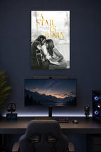 A Star Is Born Movie in a gaming desk setup above a monitor.