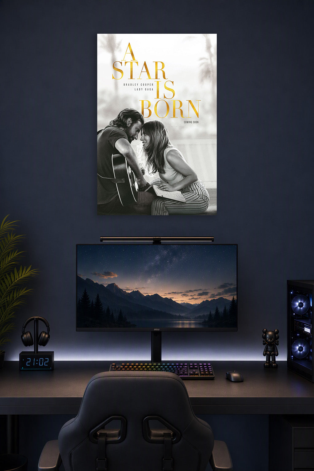 A Star Is Born Movie in a gaming desk setup above a monitor.