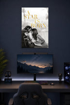 A Star Is Born Movie Poster in a gaming desk setup above a monitor.