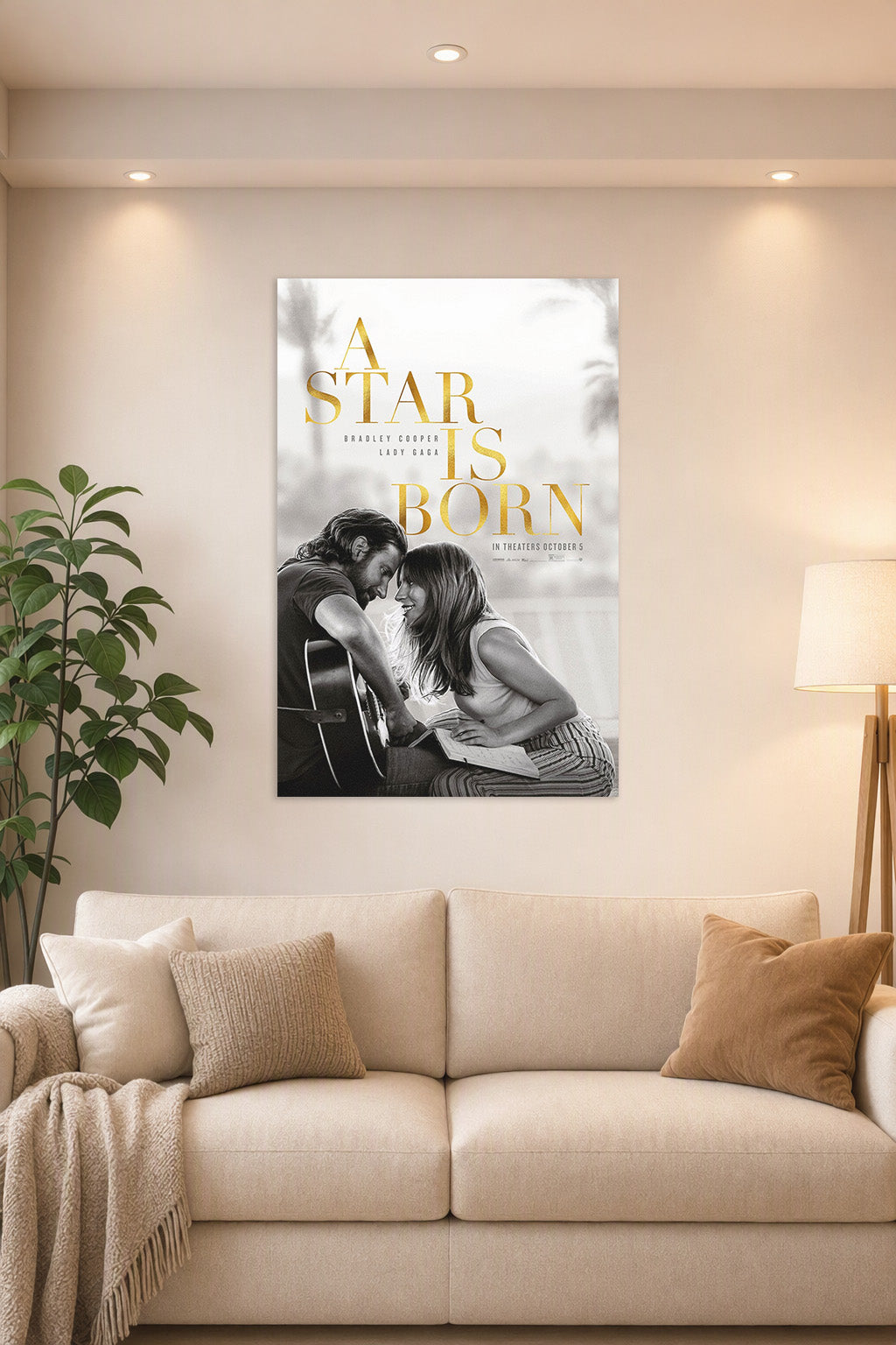 A Star Is Born Movie Poster in a bright living room above a beige sofa.