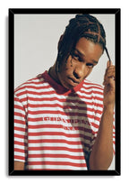 A$AP Rocky framed wall art print with a black border, portraying him holding a braid in a red and white striped shirt.