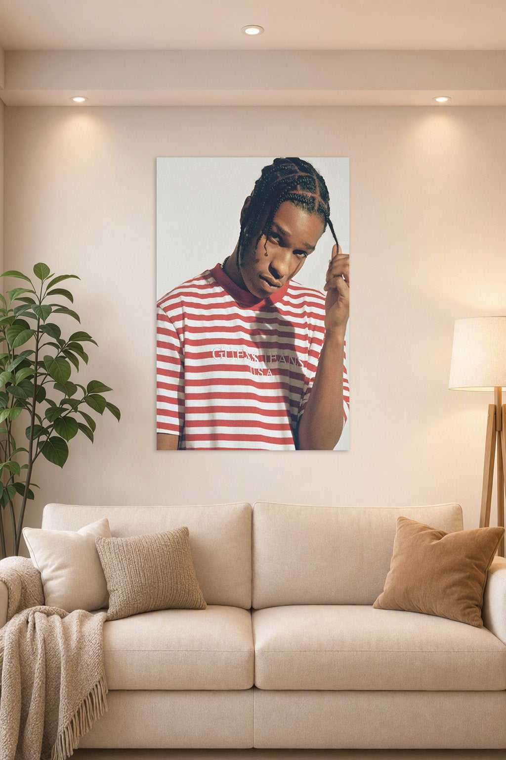 A$AP Rocky in a bright living room above a beige sofa.