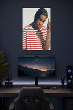 A$AP Rocky in a gaming desk setup above a monitor.