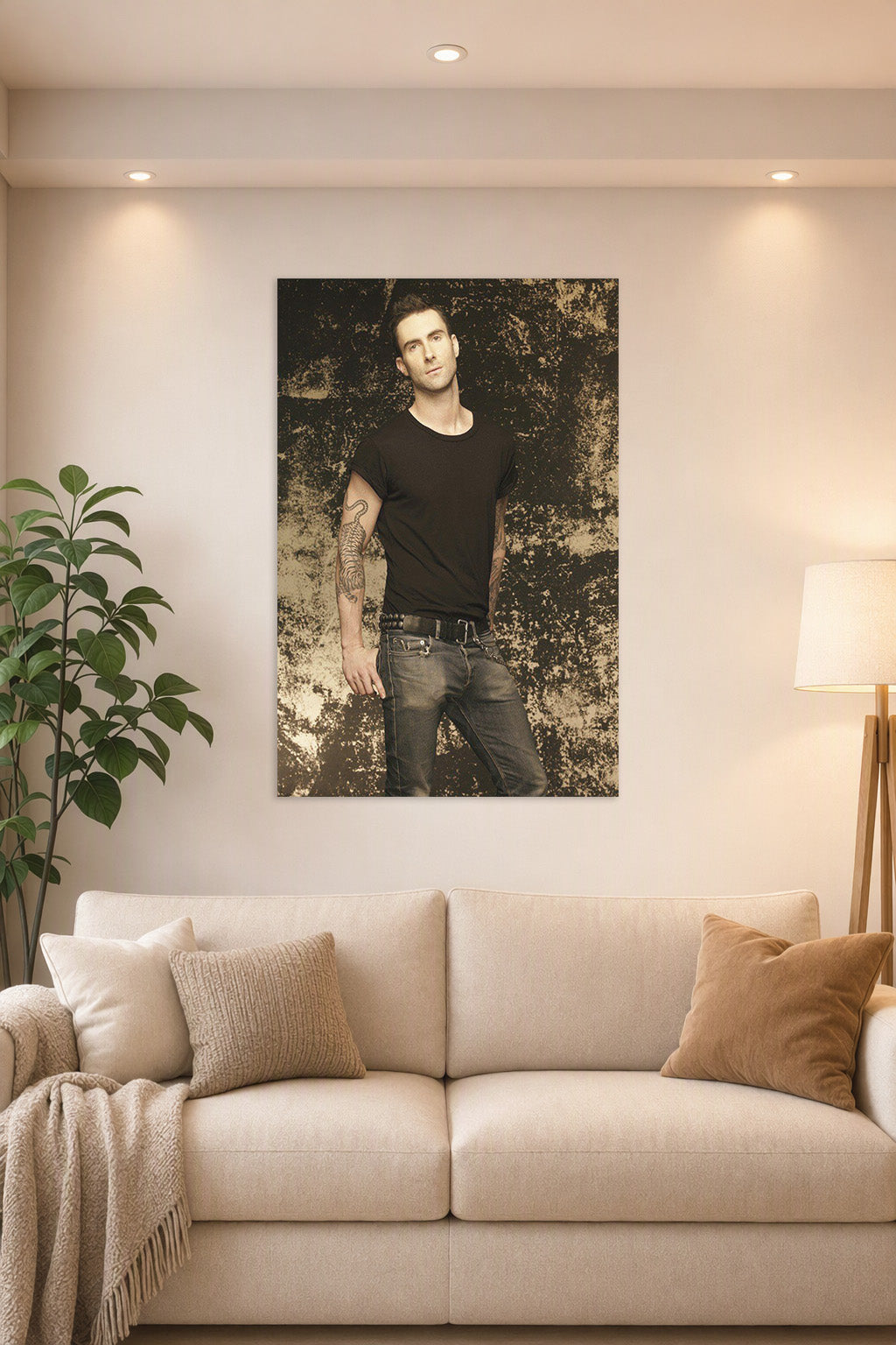 Adam Levine in a bright living room above a beige sofa.