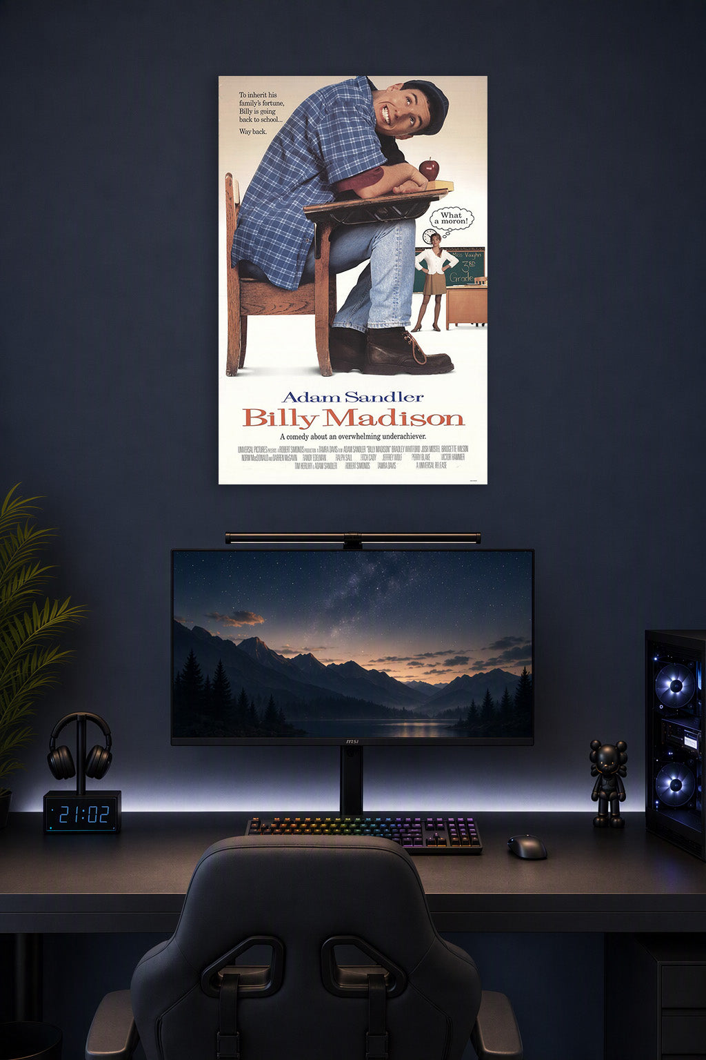 Adam Sandler Billy Madison in a gaming desk setup above a monitor.