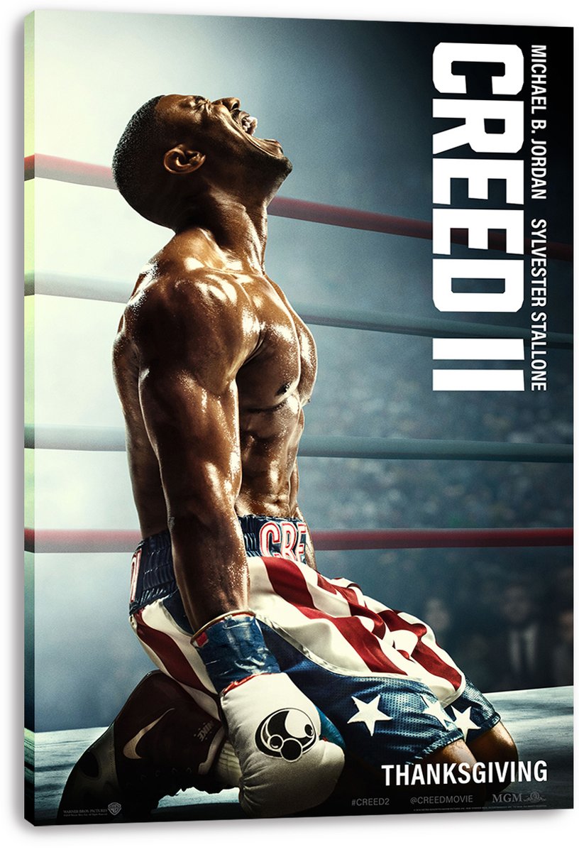 Creed II canvas wall art print featuring Adonis Creed kneeling and roaring in a misty boxing ring, with bold vertical title text.