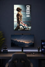 Adonis Creed Michael B. Jordan Creed II Movie in a gaming desk setup above a monitor.