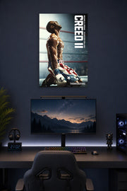 Adonis Creed Michael B. Jordan Creed II Movie in a gaming desk setup above a monitor.