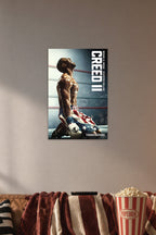Adonis Creed Michael B. Jordan Creed II Movie in a cozy movie room above a brown sofa with popcorn.