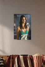 Adrianne Palicki in a cozy movie room above a brown sofa with popcorn.