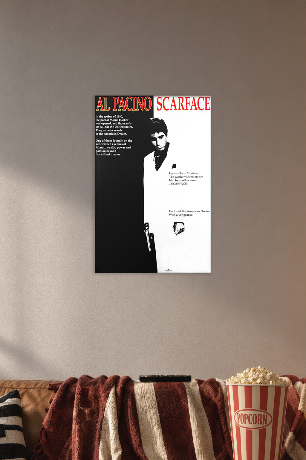 Al Pacino Scarface Tony Montana in a cozy movie room above a brown sofa with popcorn.