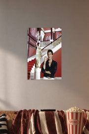 Al Pacino Scarface Tony Montana in a cozy movie room above a brown sofa with popcorn.