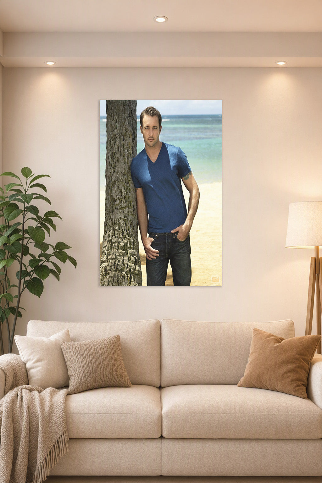 Alex O'Loughlin in a bright living room above a beige sofa.