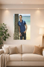 Alex O'Loughlin in a bright living room above a beige sofa.