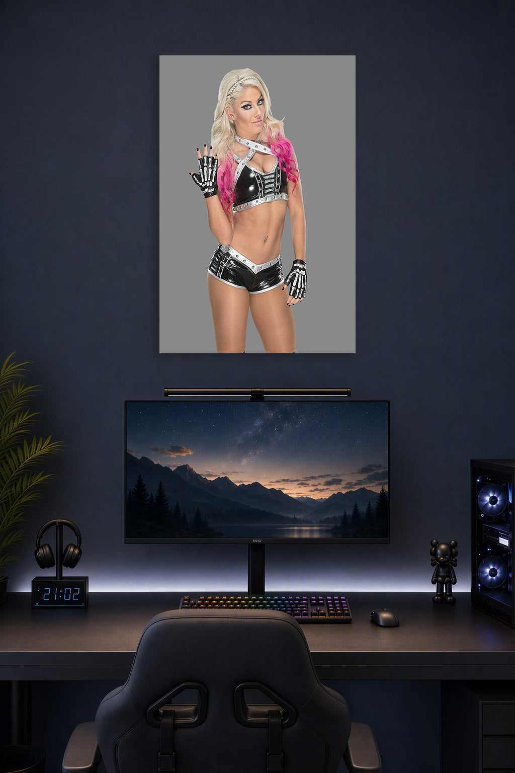 Alexa Bliss in a gaming desk setup above a monitor.