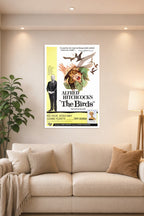 Alfred Hitchcock's The Birds Movie Poster in a bright living room above a beige sofa.
