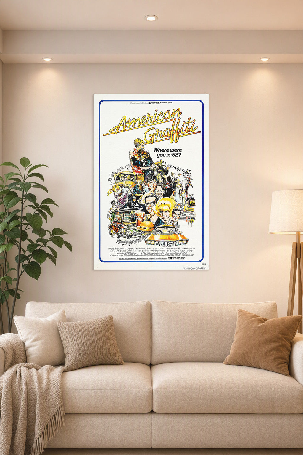 American Graffiti Movie Poster in a bright living room above a beige sofa.