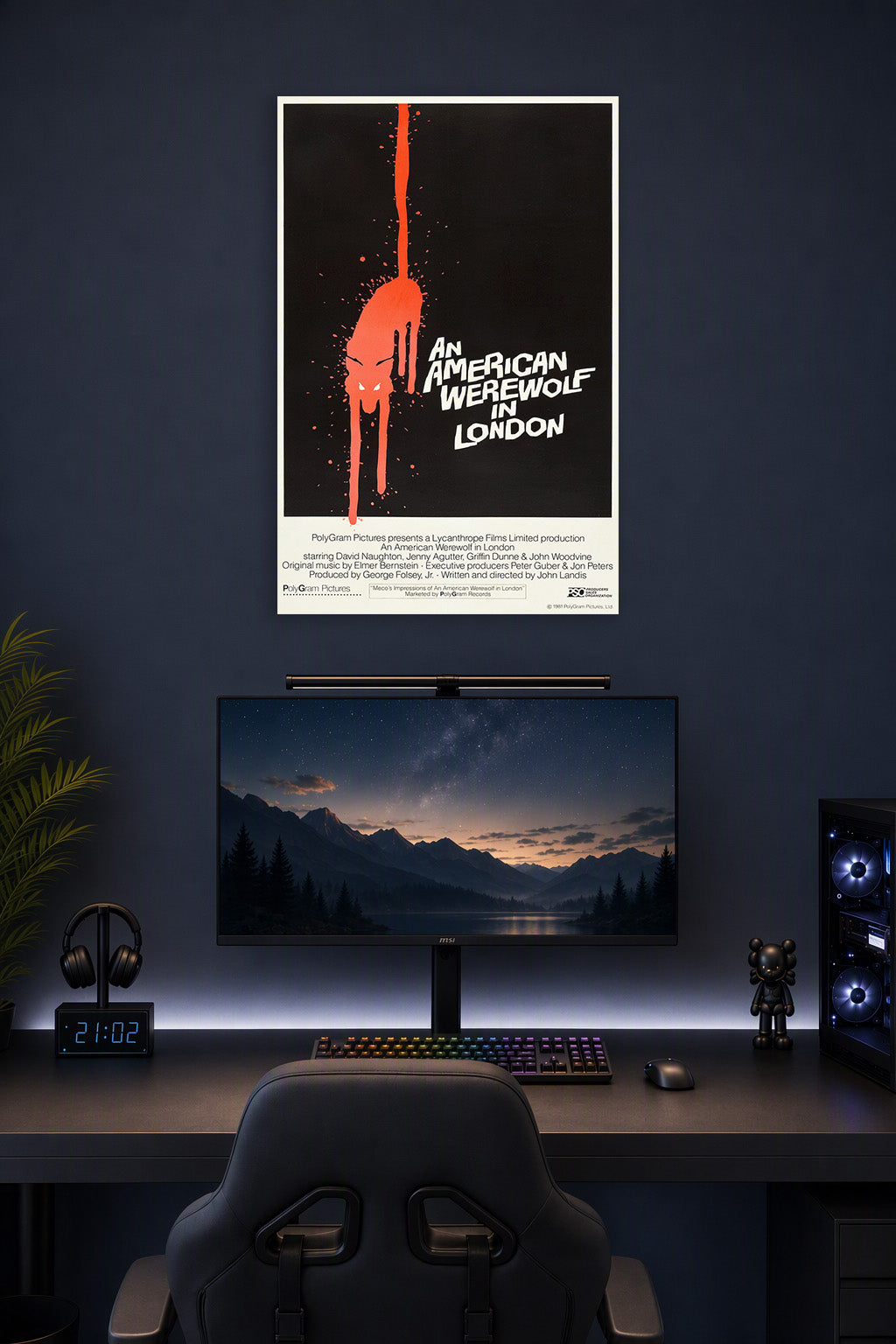 An American Werewolf in London Movie Poster in a gaming desk setup above a monitor.