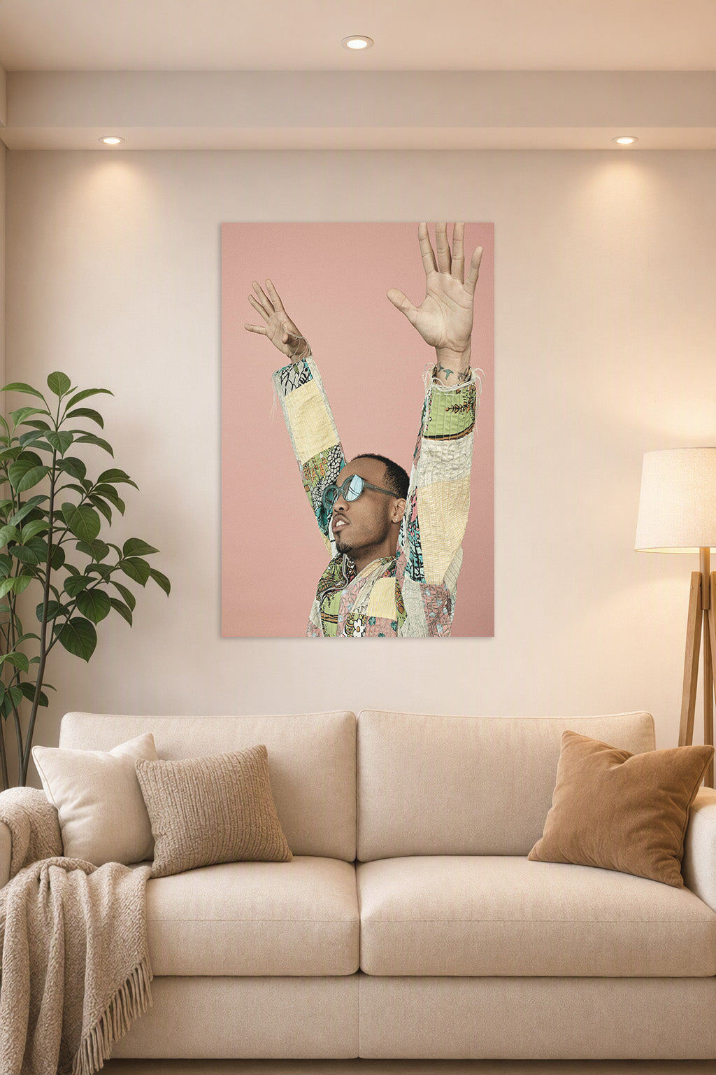 Anderson .Paak in a bright living room above a beige sofa.