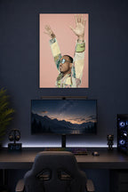 Anderson .Paak in a gaming desk setup above a monitor.