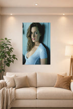 Anne Hathaway in a bright living room above a beige sofa.