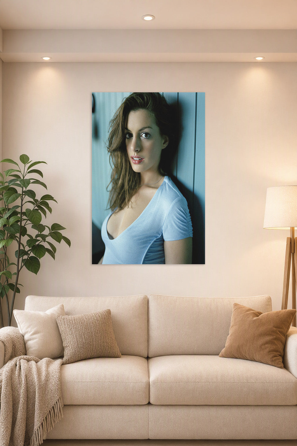 Anne Hathaway in a bright living room above a beige sofa.