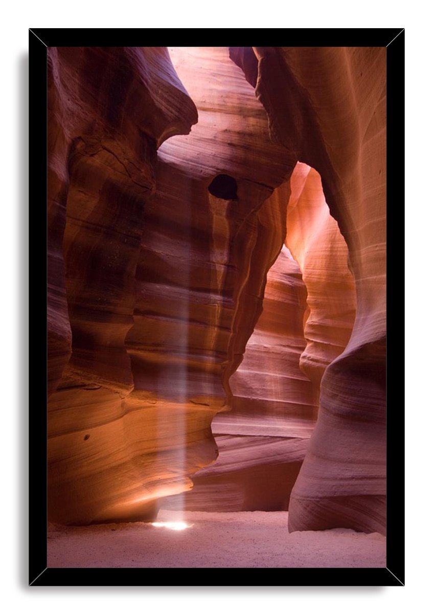 Antelope Canyon framed wall art print in a black border, depicting curving amber sandstone and vertical sunlight.