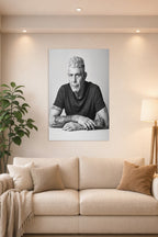 Anthony Bourdain in a bright living room above a beige sofa.