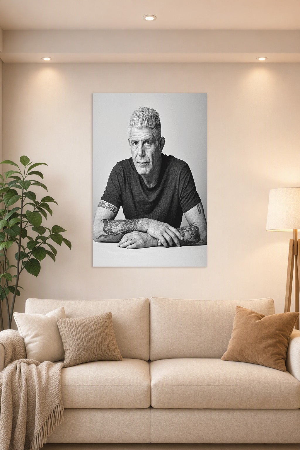 Anthony Bourdain in a bright living room above a beige sofa.