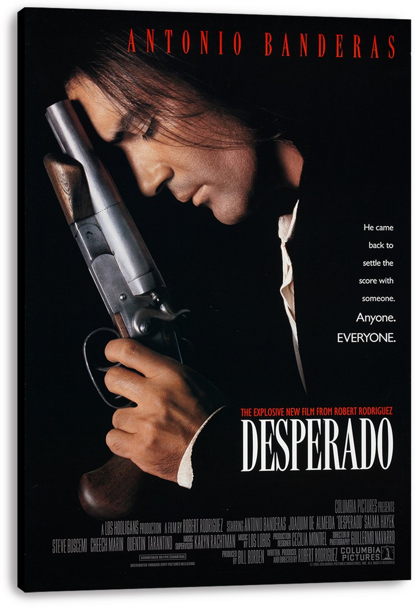 Desperado canvas wall art print featuring Antonio Banderas in profile gripping a shotgun, with bold white title text on black.