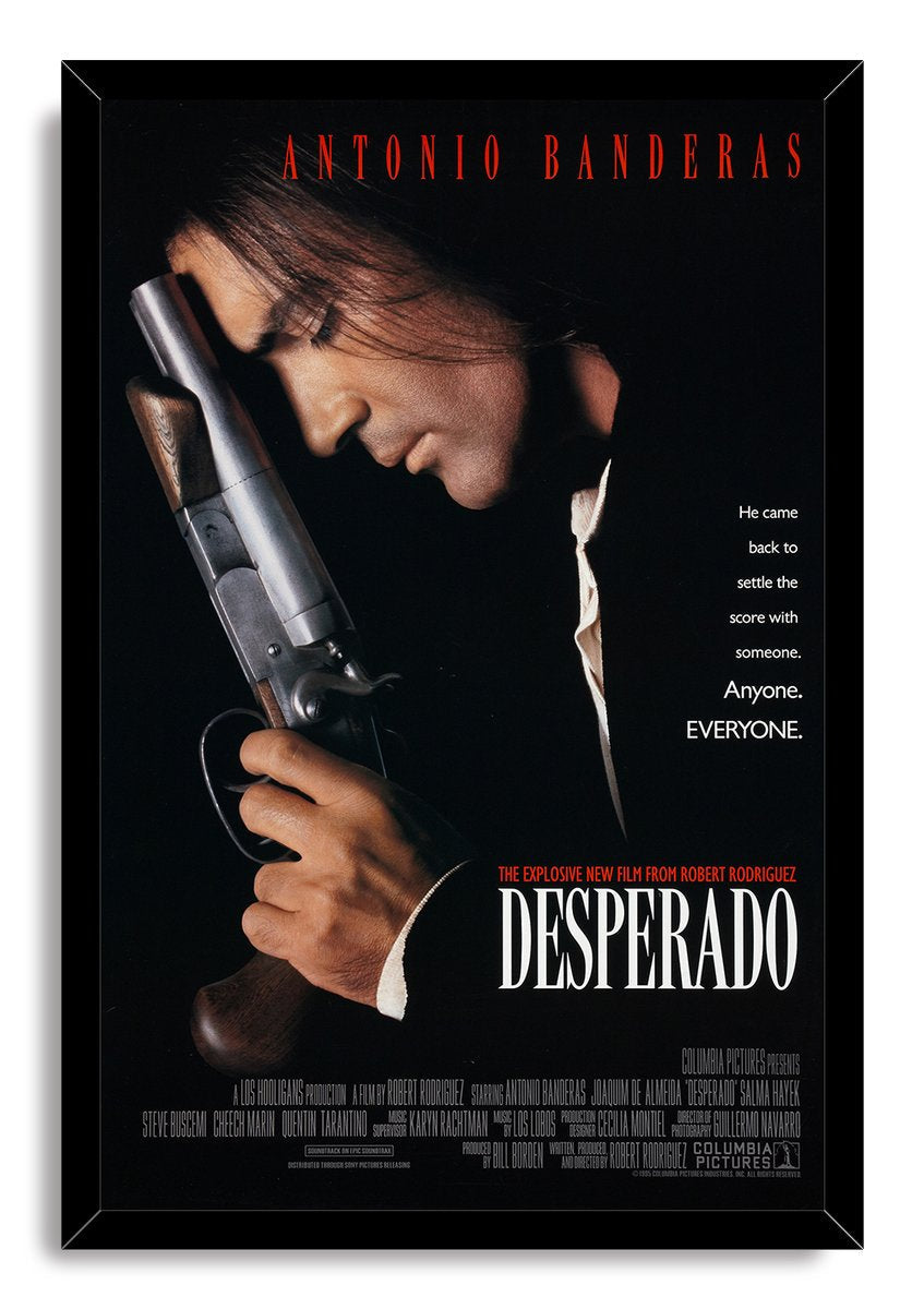 Desperado framed wall art print with Antonio Banderas holding a shotgun, red cast text, and a black mitered frame.