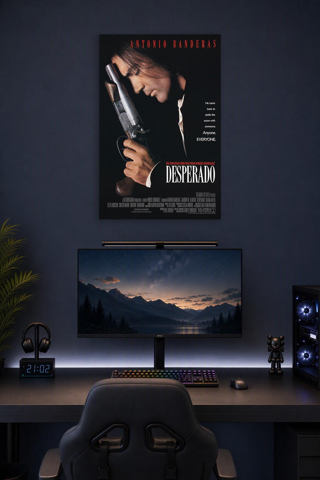 Antonio Banderas Desperado in a gaming desk setup above a monitor.