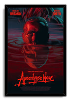 Apocalypse Now framed wall art print features a half-submerged red-lit man's face amid teal ripples in a black frame.