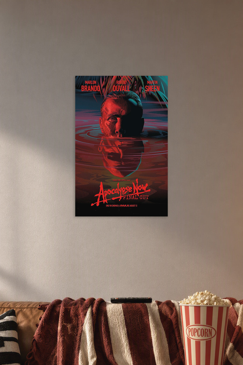 Apocalypse Now Movie Poster in a cozy movie room above a brown sofa with popcorn.