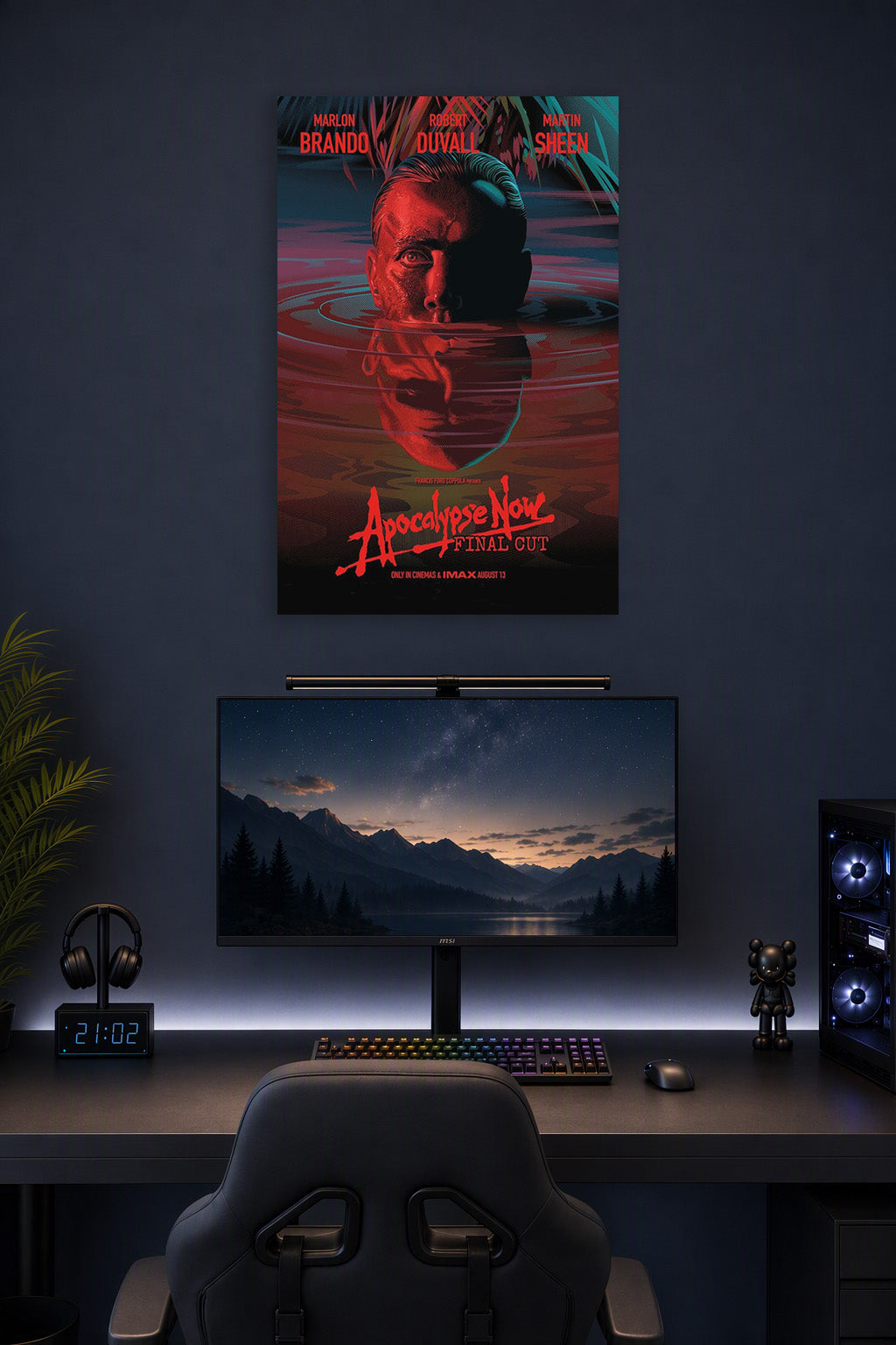 Apocalypse Now Movie Poster in a gaming desk setup above a monitor.