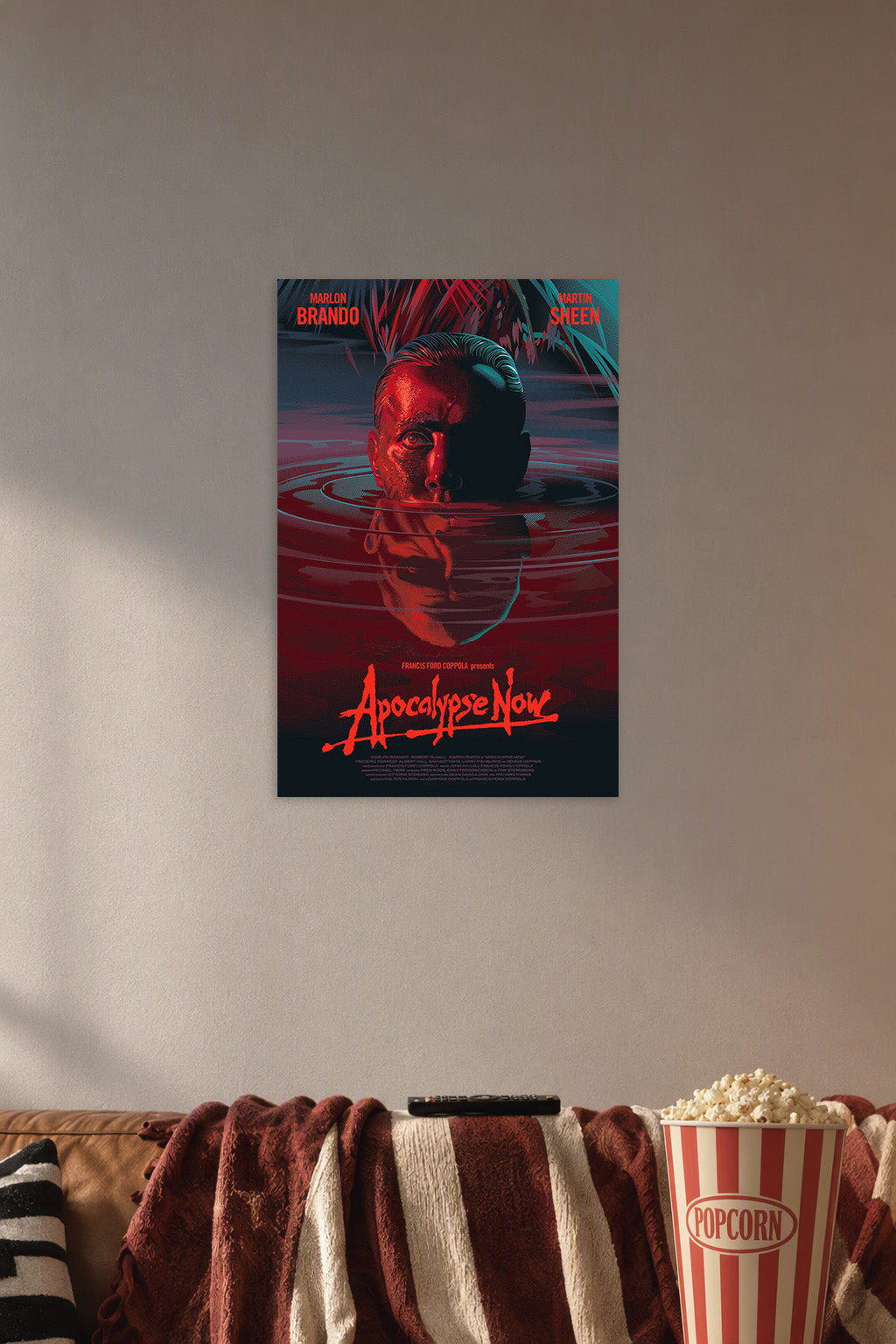 Apocalypse Now Movie Poster in a cozy movie room above a brown sofa with popcorn.