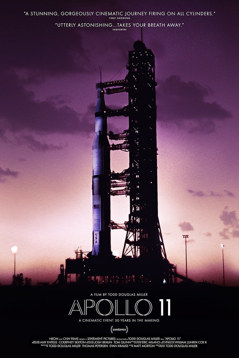 Apollo 11 poster features a Saturn V rocket and launch tower silhouetted against a purple-pink dusk sky, with film text below.
