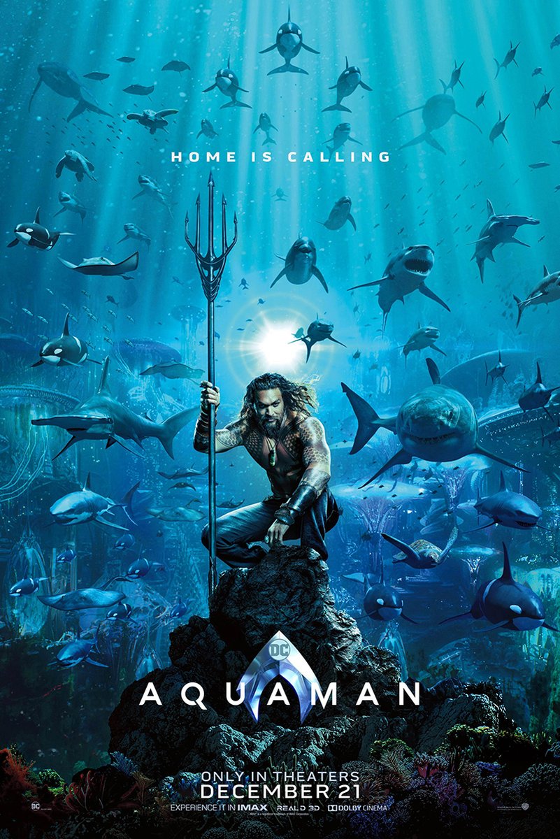 Aquaman poster print features the armored hero holding a trident beneath sunbeams, surrounded by sharks and other sea life.