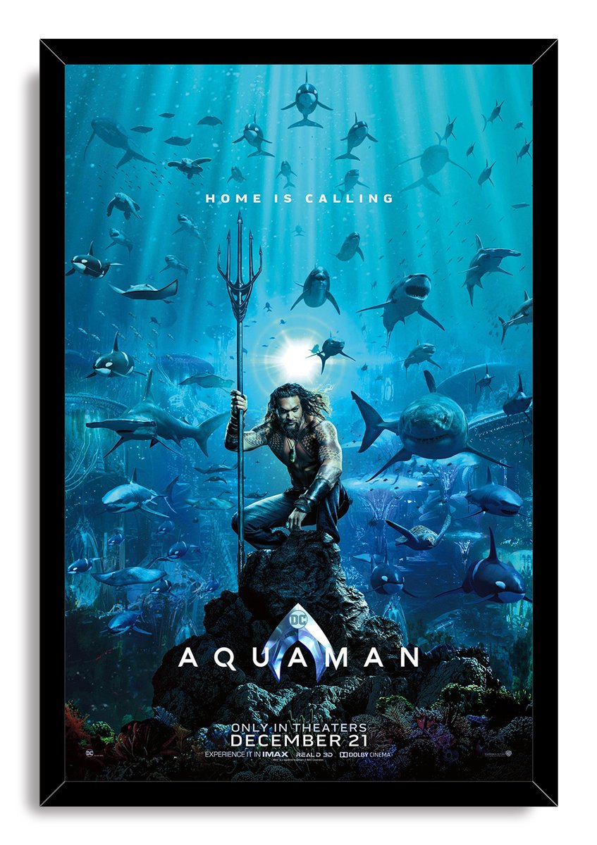 Aquaman framed wall art print displays the hero with his trident in a vivid blue underwater scene filled with sharks and orcas.